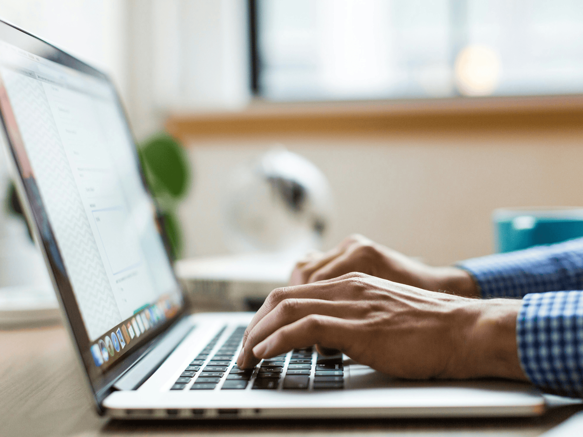 laptop with male hands on it