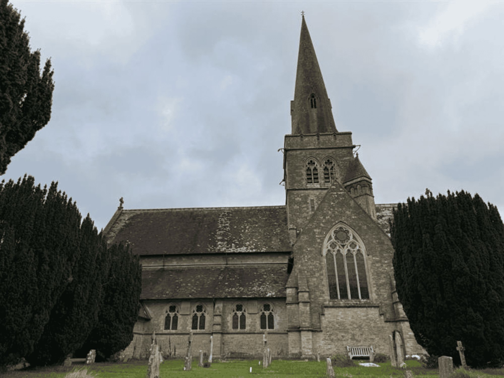 stone church with high pointy steeple