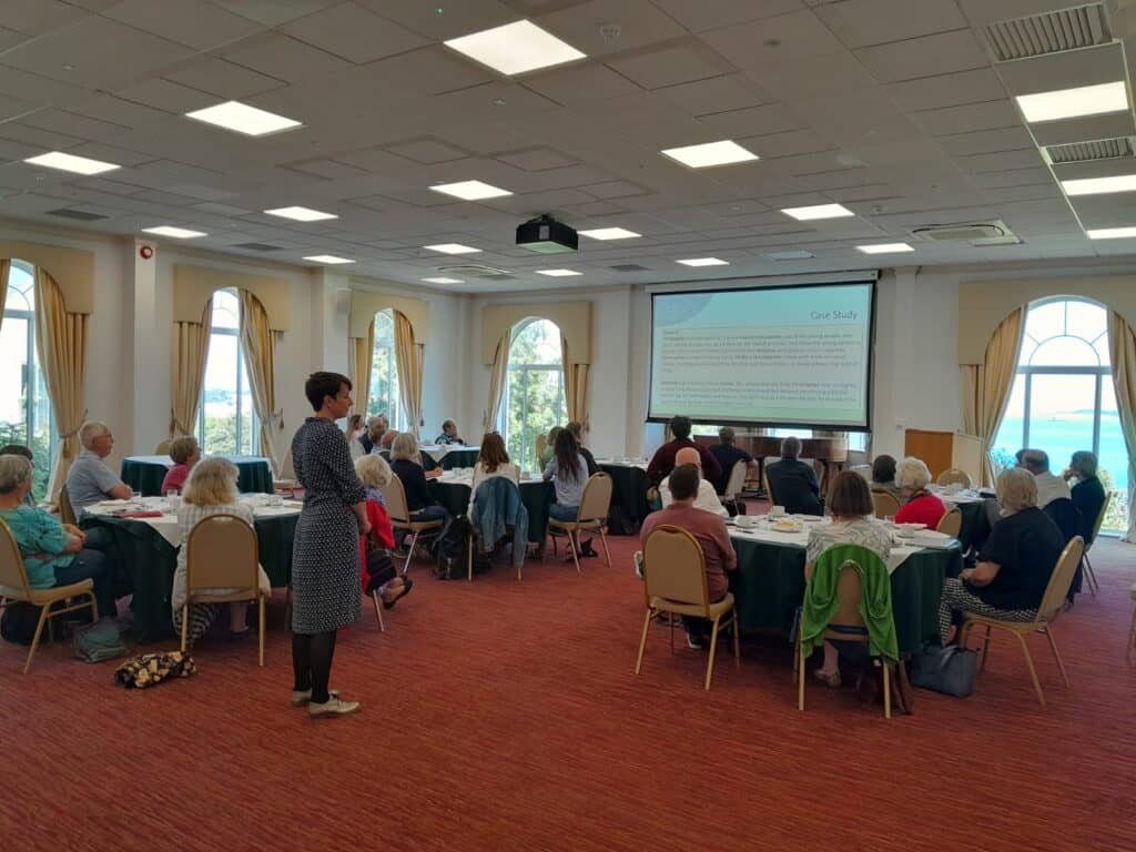 image of groups seated around a presentation