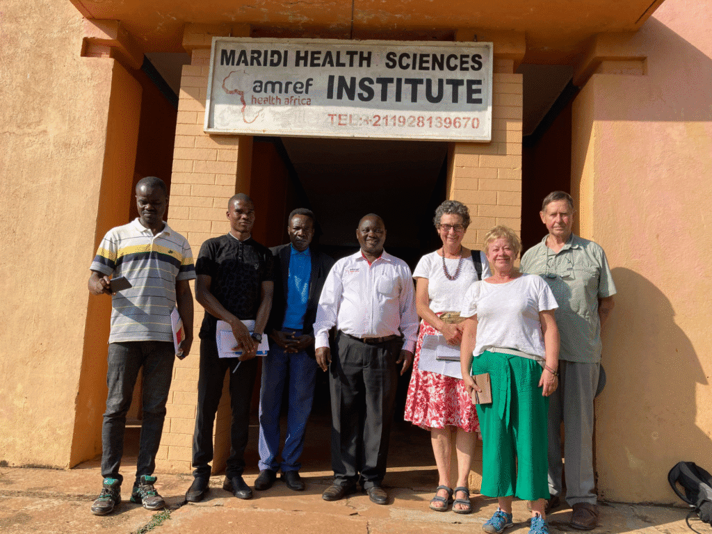 group of people outside medical institute in sudan